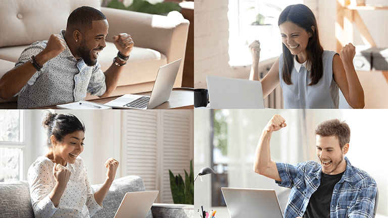 Diverse group of people expressing success and joy while using laptops